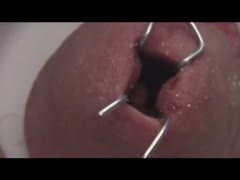 Masochist man hurting himself by destroying his dick